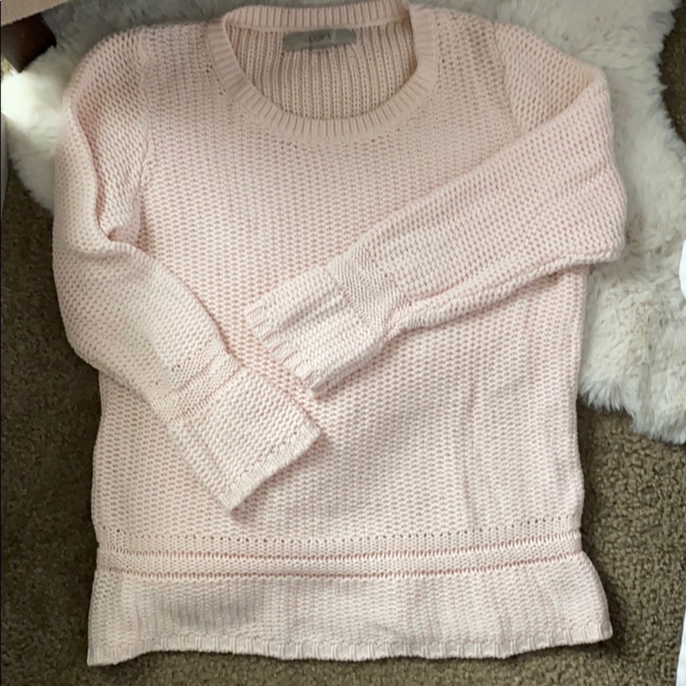Light pink knit sweater.